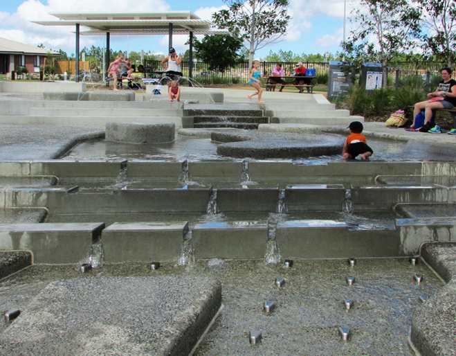 Darlington Parklands Yarrabilba - children playing with water jets 