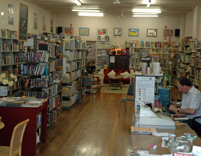 Books on shelves inside Annerley Community Bookshop
