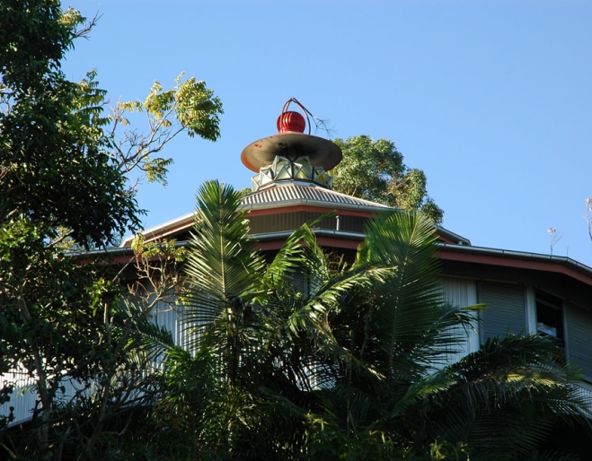 Carpenter Hall House rooftop through trees in Wilston