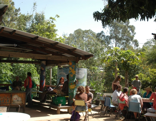 People sitting at tables outside Chai Cafe eating breakfast in Brisbane's Windsor