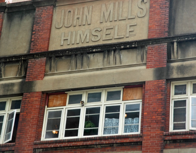 john Mills Himself sign on building in Brisbane's Charlotte street.