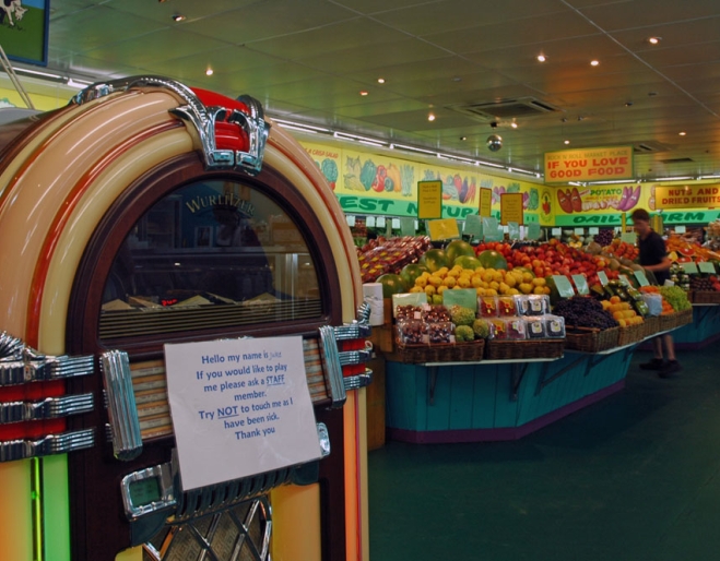 junk box and fruit and vegetable aisles inside Rock’n’Roll Marketplace Greenslopes