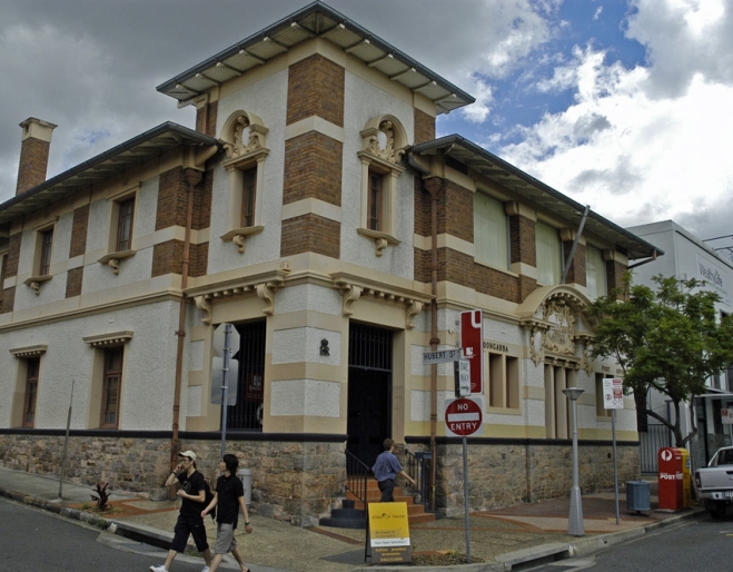 Pedestrians walking in front of Woolloongabba Post Office