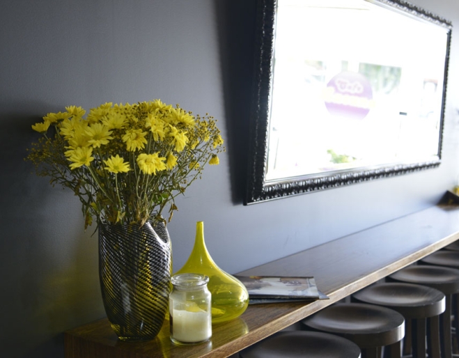 Fresh flowers sitting on bench inside Cafe Lacuna in  Wavell Heights Brisbane.