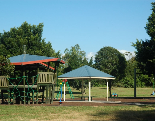Playground equipment and fort inside Faulkner Park Graceville