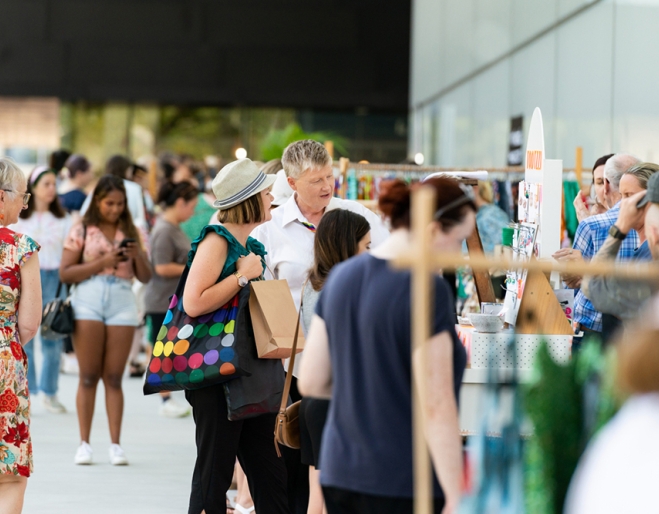 People browsing stalls QAGOMA Christmas Design Market