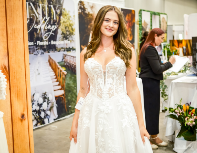 Girl posing in a wedding dress Brisbane's Annual Wedding Expo