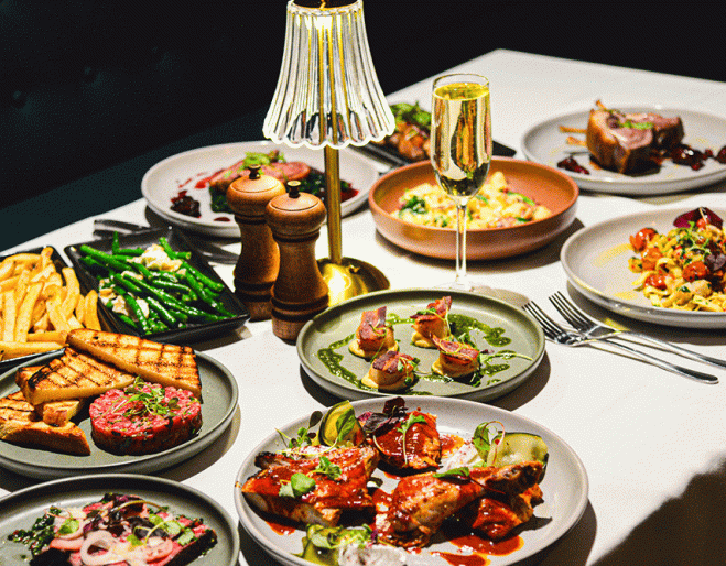 Food on plates at Hepburn's Steakhouse Wynnum