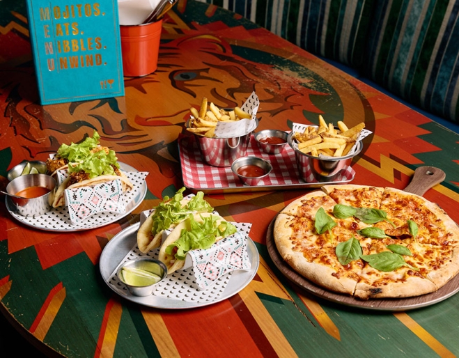 Plates of food on table at Archie Bros
