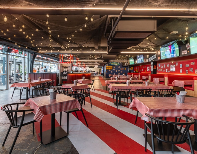 Red checked tables inside Claw Bowen Hills