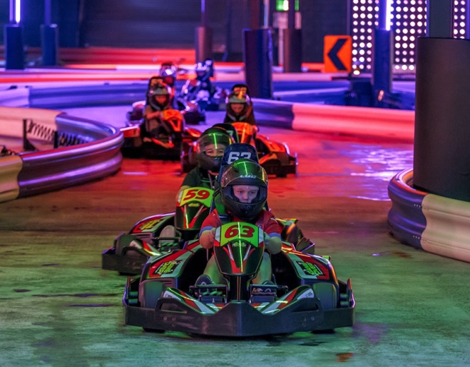 kids in go-karts at Game Over