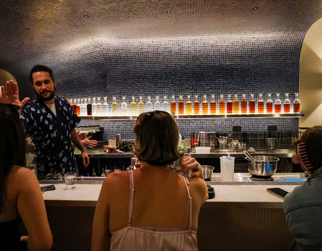 People sitting at a cocktail bar