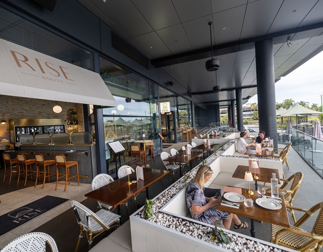 People seated on terrace at Rise Le Restaurant 