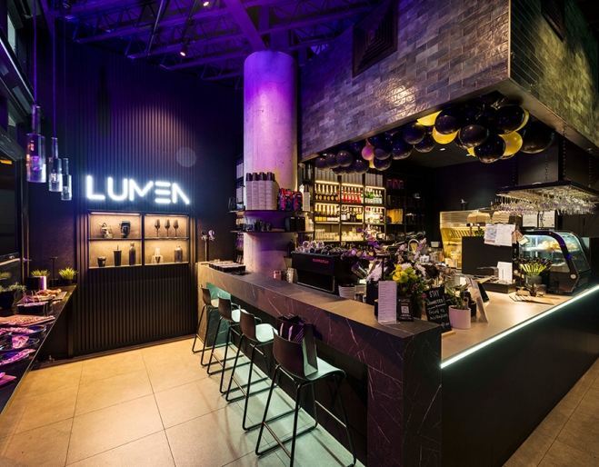 Bar with green stools inside Lumen Cafe Lounge Toowong