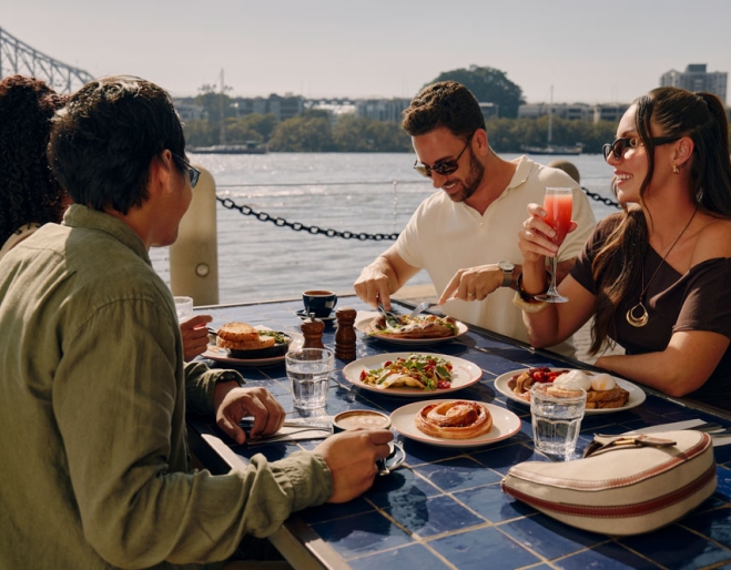 People eating breakfast on the Brisbane River