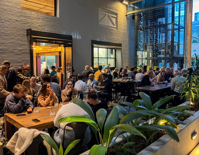People seated on terrace at Mr Bao