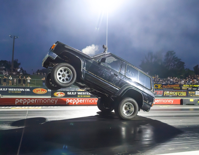 Big car doing a wheelie at Planes, Trains And Autos 2026