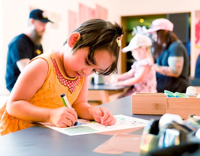 Child doing activities at Museum of Brisbane
