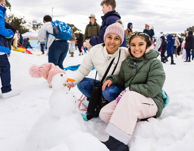 Women sitting in Snow 