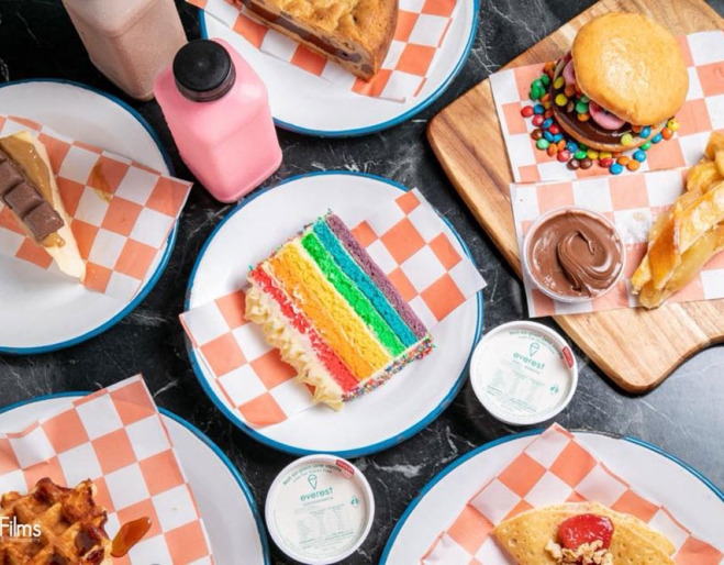 Cakes and desserts on plates at Sweet Tooth Gelato & Desserts Hawthorne