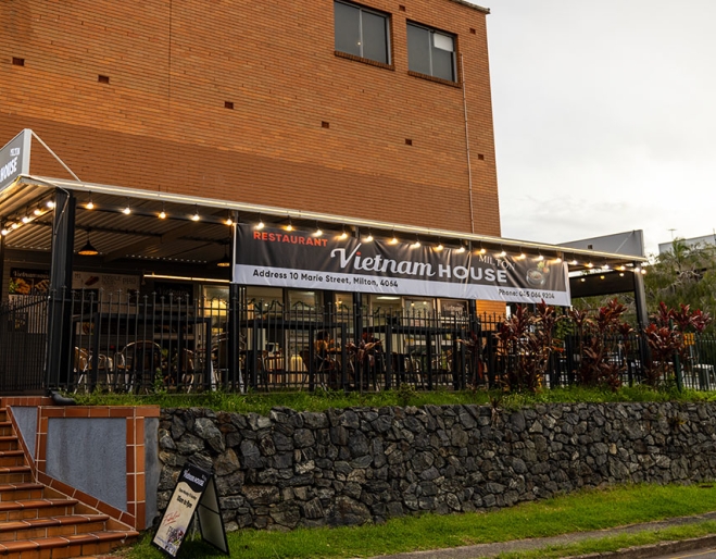 Exterior of Vietnam House Milton showing outside seating
