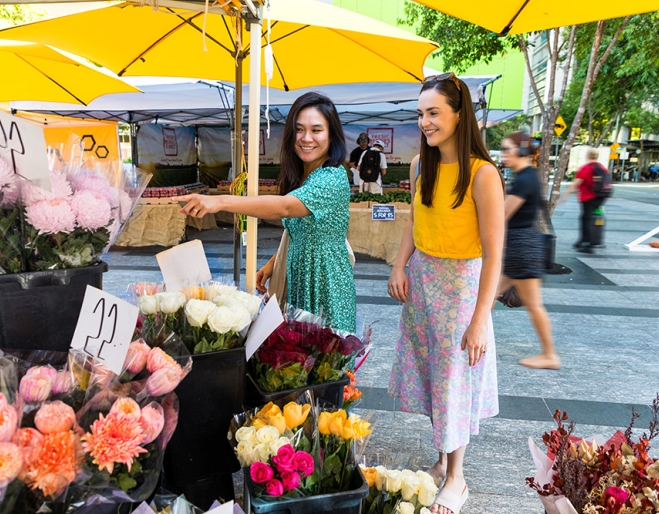 people at market stall