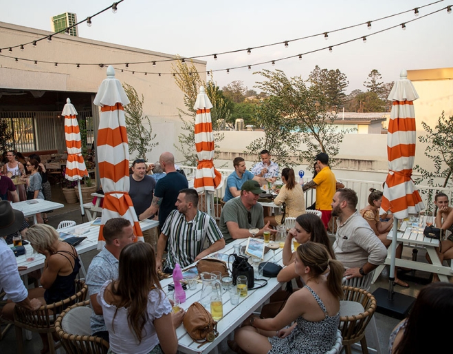 People dining and drinking at Tetto Rooftop Bar - Everton Plaza, Everton Park