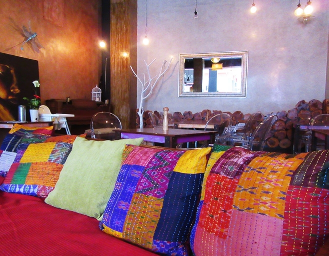 Colourful cushions on a lounge chair at Gabi Cafe Woolloongabba