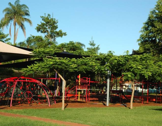 Playground equipment and vegetation surrounding Gregory Park in Milton