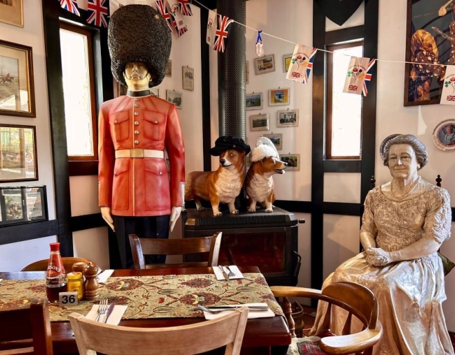 Prince Charles and Queens Elizabeth statues inside the Fox & Hounds Country Inn