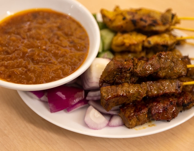 Satay sticks on plate at Mamak CBD