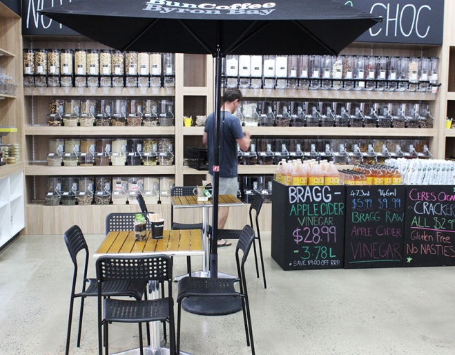 Person selecting bulk foods at Kiah Organic Wholefoods Warehouse Mt Gravatt