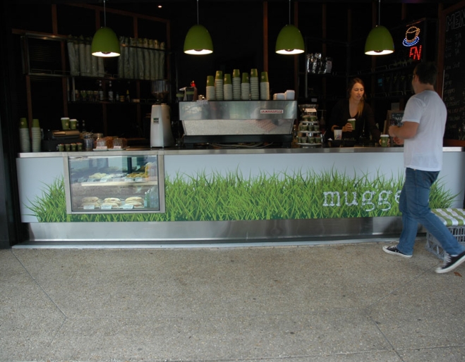 Man buying cup of coffee at counter of Mugged Espresso Bar in Bulimba