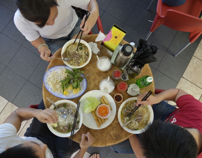 Group of people eating pho outside Pho Hien Vuong Pasteur restaurant in Sunnybank