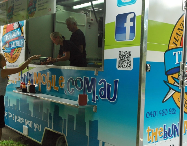 Person being served at The Bun Mobile counter in Bulimba.