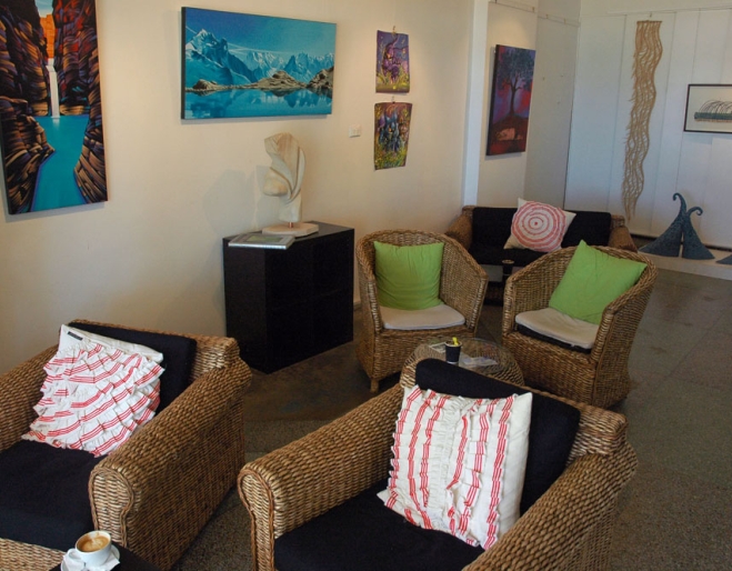 Seating and paintings and sculptures inside Valori espresso Lounge