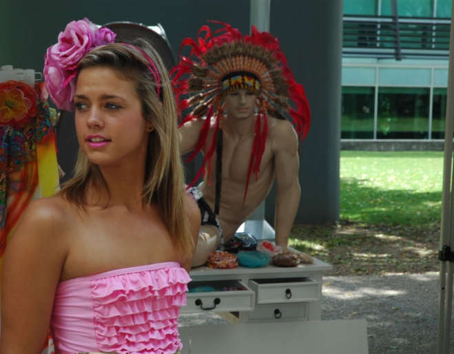 Woman in designer bikini in front of stall in the Young Designers Market South Bank