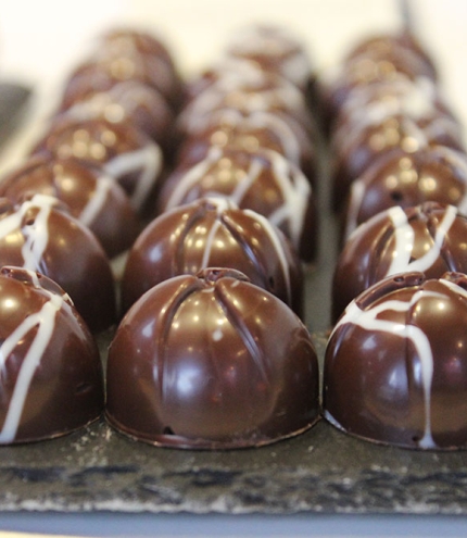 Three rows of little chocolates inside 31 Degrees Custom Chocolates Woolloongabba