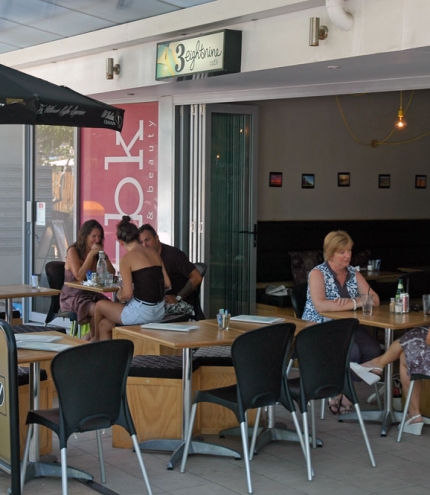 People dining outside 3Eightnine cafe, Scarborough