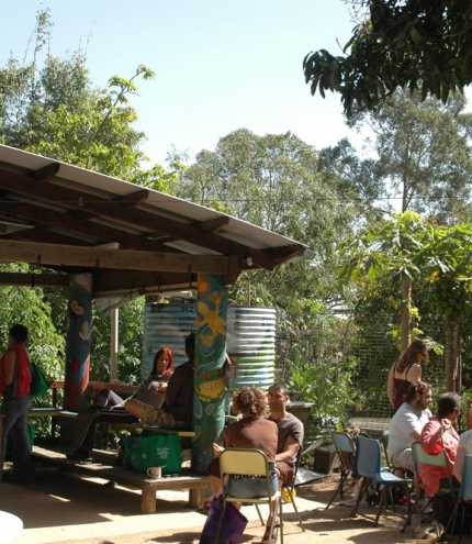 People sitting at tables outside Chai Cafe eating breakfast in Brisbane's Windsor
