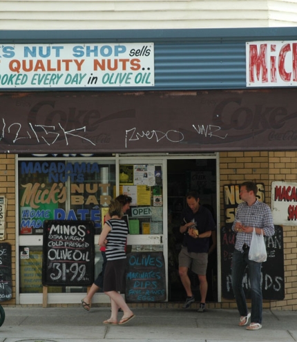 People standing outside Mick’s Nuts in West End.