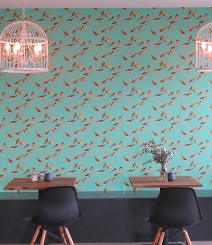 Tables and chairs inside Birds And Bees Cafe Everton Hills
