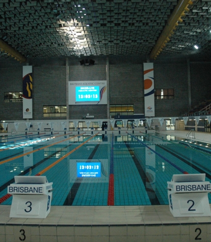 indoor lap pool and lanes with giant tv screen 