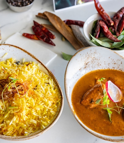Dishes of food on table THE-KARI-INDIAN-RESTAURANT