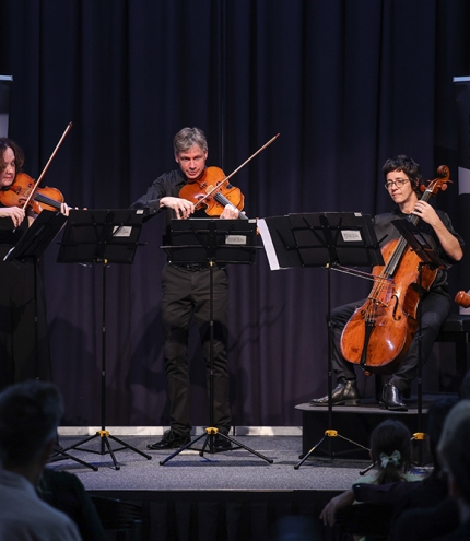 ARCO Orchestra performing on stage 