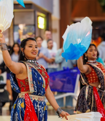 two ladies do a traditional dance