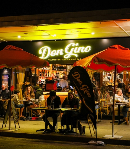Tables on street at Don Gino West End