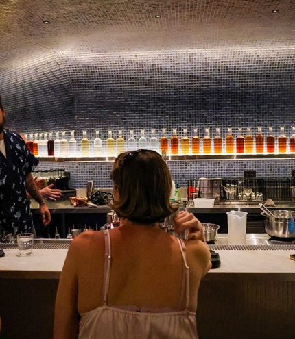 People sitting at a cocktail bar