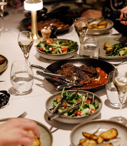 Diners at a table inside Lamberts Restaurant