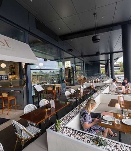 People seated on terrace at Rise Le Restaurant 